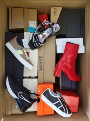 The photo shows a package with footwear in the category AS.