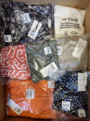 The photo shows a package with clothing in the category YA.