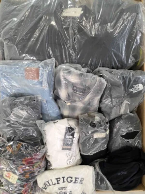 The photo shows a package with clothing in the category D.