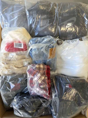 The photo shows a package with clothing in the category D.