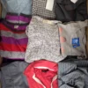 The photo shows a package with clothing in the category U.