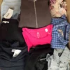 The photo shows a package with clothing in the category U.