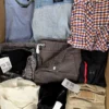 The photo shows a package with clothing in the category U.