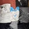 The photo shows a package with clothing in the category U.
