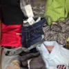 The photo shows a package with clothing in the category U.