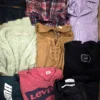The photo shows a package with clothing in the category U.