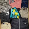 The photo shows a package with clothing in the category U.