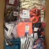The photo shows a package with clothing in the category ABW.