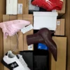 The photo shows a package with footwear in the category BS.
