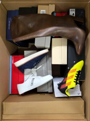 The photo shows a package with footwear in the category BS.