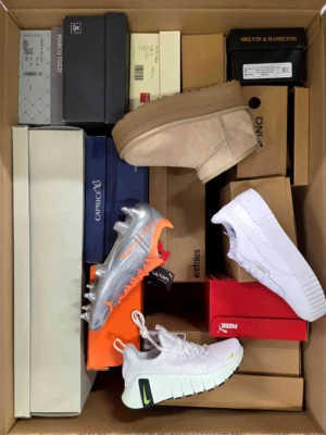 The photo shows a package with footwear in the category BS.