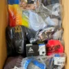 The photo shows a package with clothing in the category AU.