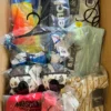 The photo shows a package with clothing in the category AU.