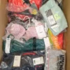 The photo shows a package with clothing in the category AU.