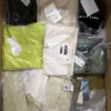 The photo shows a package with clothing in the category AM.