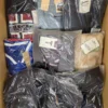 The photo shows a package with clothing in the category AM.