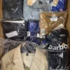 The photo shows a package with clothing in the category AM.