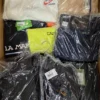 The photo shows a package with clothing in the category AM.