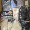 The photo shows a package with clothing in the category AM.