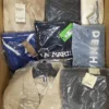 The photo shows a package with clothing in the category AM.