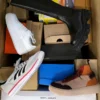 The photo shows a package with footwear in the category CS.