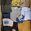 The photo shows a package with clothing in the category TSC.