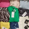 The photo shows a package with clothing in the category TSC.