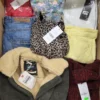 The photo shows a package with clothing in the category TSC.