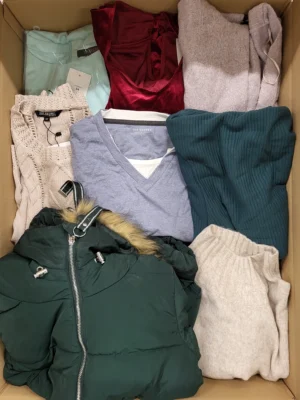 The photo shows a package with clothing in the category TSC.
