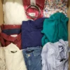 The photo shows a package with clothing in the category TSC.