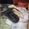 The photo shows a package with clothing in the category TSC.