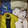The photo shows a package with clothing in the category TSC.