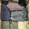 The photo shows a package with clothing in the category TSC.