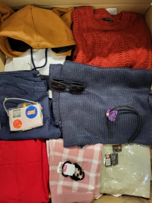 The photo shows a package with clothing in the category TSC.