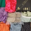 The photo shows a package with clothing in the category SN.