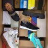 The photo shows a package with footwear in the category AS.