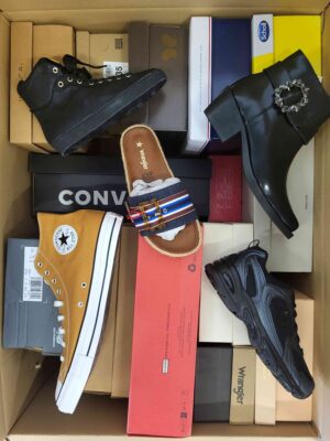 The photo shows a package with footwear in the category AS.