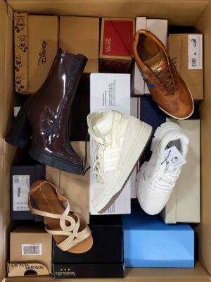 The photo shows a package with footwear in the category AS.