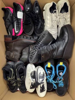 The photo shows a package with footwear in the category SH.