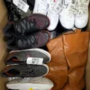 The photo shows a package with footwear in the category SH.