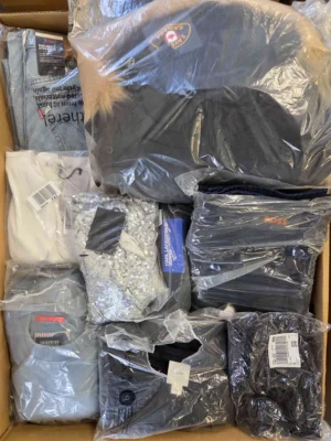 The photo shows a package with clothing in the category D.