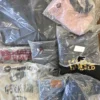 The photo shows a package with clothing in the category D.