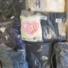 The photo shows a package with clothing in the category D.