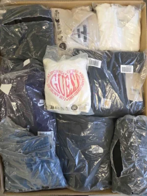 The photo shows a package with clothing in the category D.