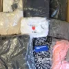 The photo shows a package with clothing in the category D.