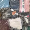 The photo shows a package with clothing in the category D.