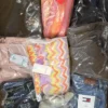 The photo shows a package with clothing in the category B.