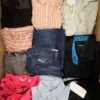 The photo shows a package with clothing in the category U.