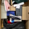The photo shows a package with footwear in the category BS.