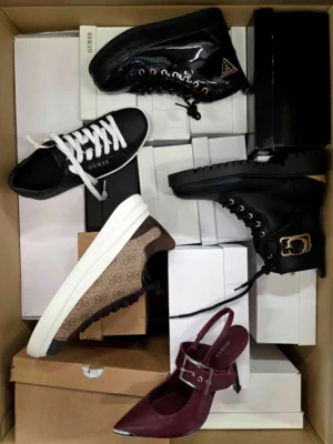 The photo shows a package with footwear in the category BS.